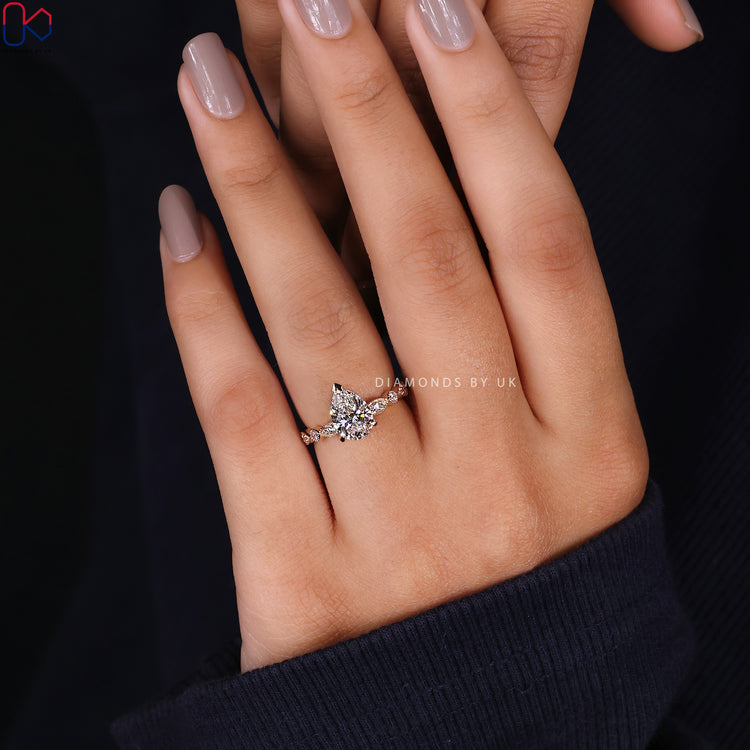 Customize ring with pear shape and milgrain setting.
