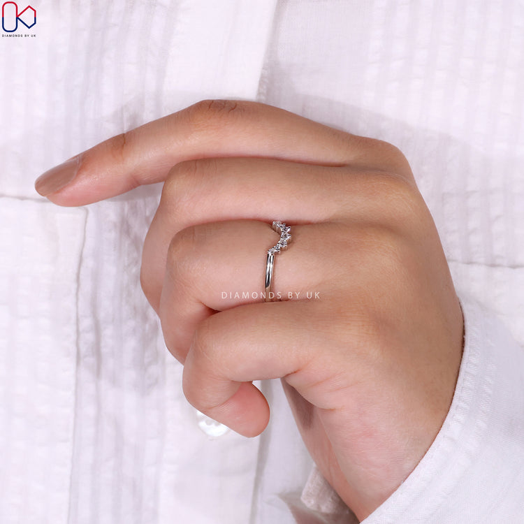 Prong set wedding band ensuring diamonds are securely placed and brilliant.
