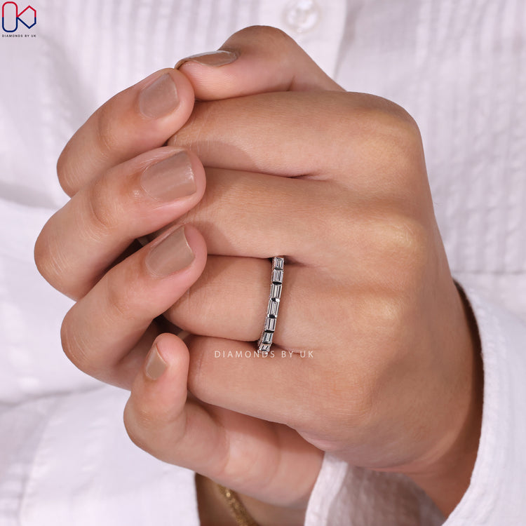 White gold wedding band with sparkling baguette diamonds for a stunning finish.
