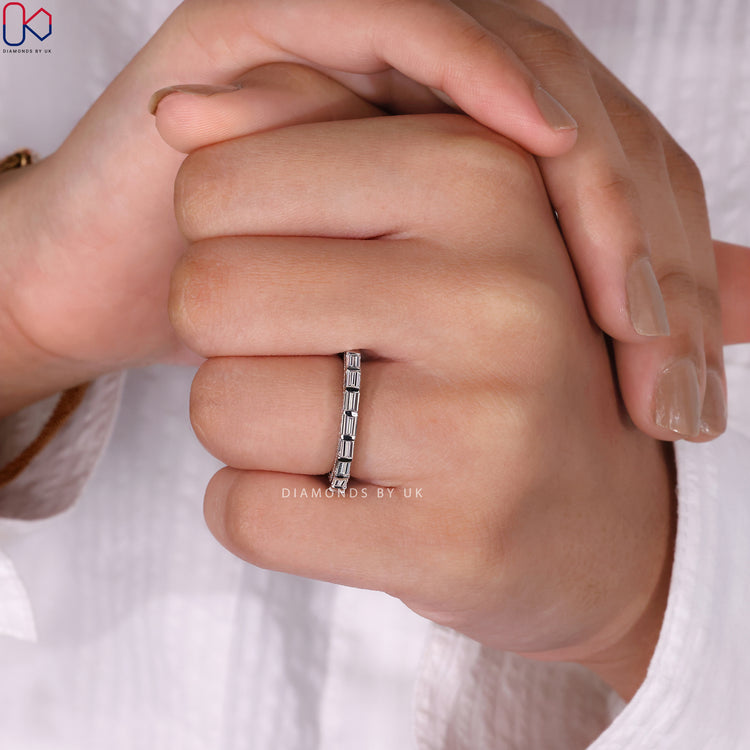 Classic bar set wedding band with baguette diamonds in a timeless setting.
