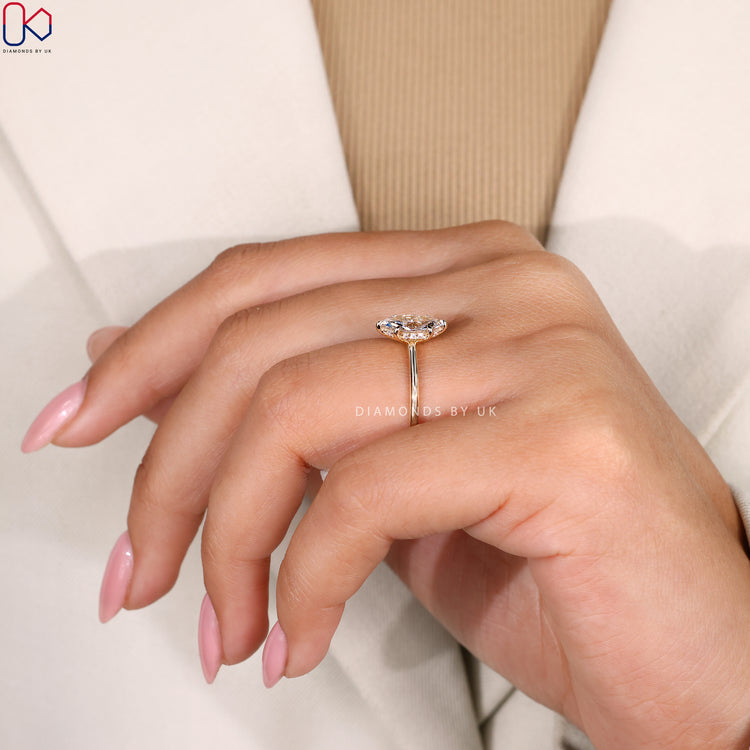 Yellow Gold ring with diamond at the center.
