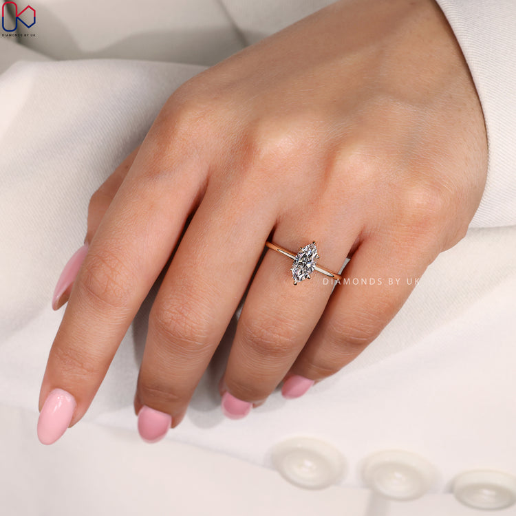 Lab-grown diamond marquise ring in a gold setting.
