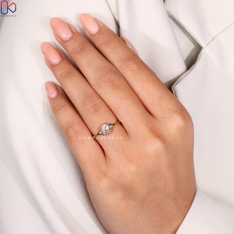 Yellow gold ring made by hand with a round rose cut diamond in centre.
