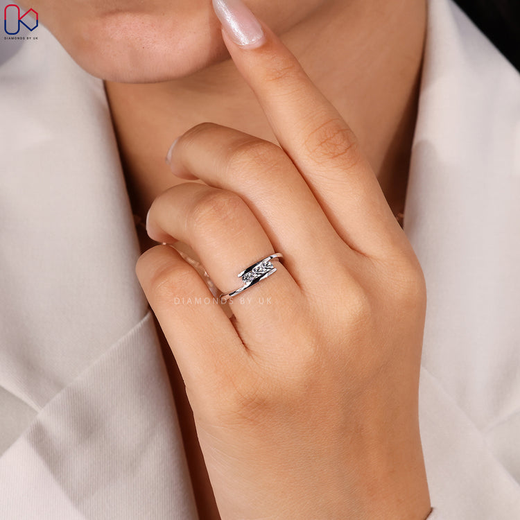 Round cut 3 stone bypass wedding band.
