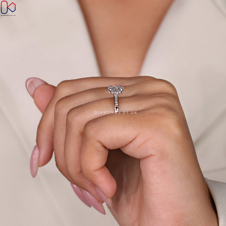 Engagement ring UK featuring a stunning pave setting ring and oval cut ring.