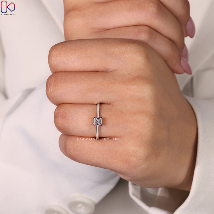 Radiant cut solitaire ring set in a classic white gold ring band.
