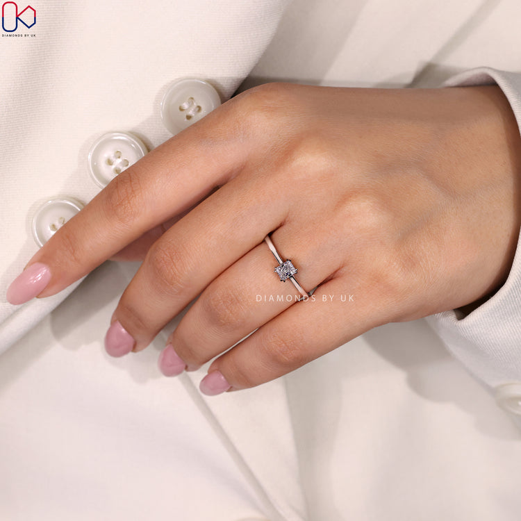 Engagement ring UK featuring a radiant cut solitaire ring in a secure setting.
