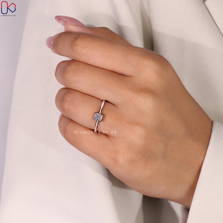 Handmade jewellery featuring a stunning radiant cut solitaire ring in a classic band.
