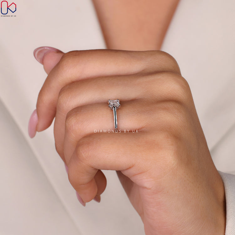 Double claw prong setting holding the radiant cut solitaire ring securely.
