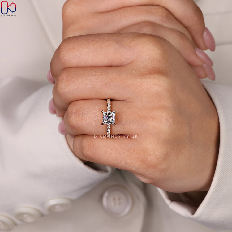 Princess cut pave ring with brilliant diamonds.
