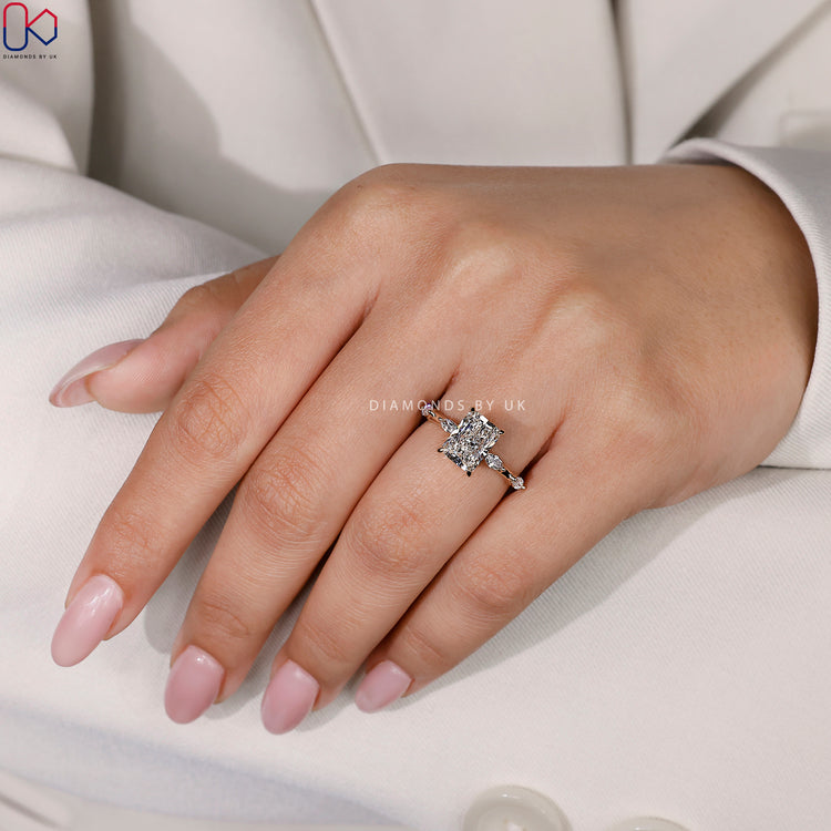 Marquise side stone engagement ring with timeless charm.
