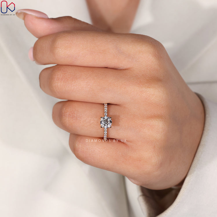 Round cut pave set engagement ring in yellow gold.

