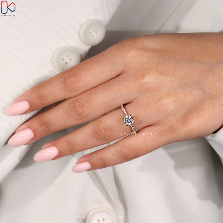 Lab grown diamond engagement ring with pave setting.
