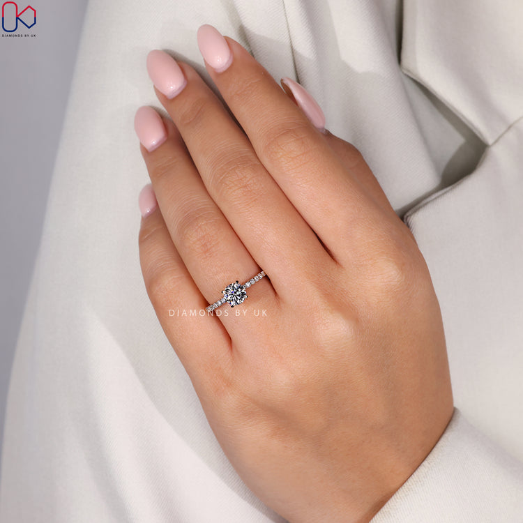 Handmade ring featuring a round cut diamond.
