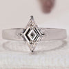 White gold ring featuring a stunning lozenge cut diamond.

