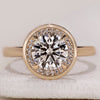 Bezel set diamond ring with a sleek and modern design.
