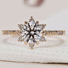 Cluster engagement ring with round cut diamonds.
