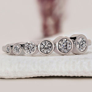 Round Cut White Gold Bezel Set Wedding Band