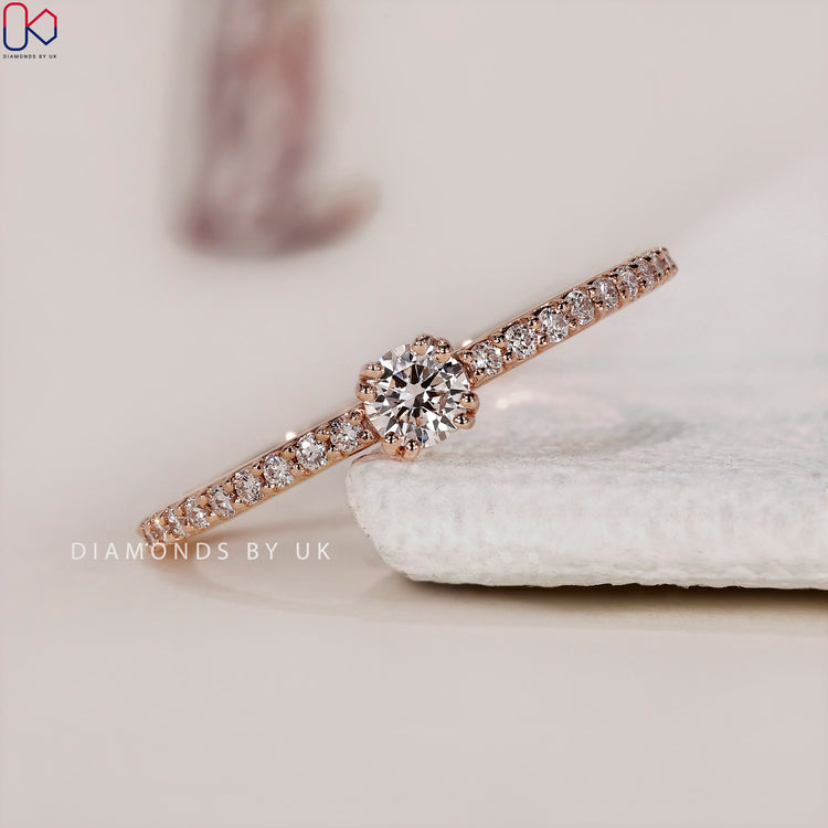 Unique handmade jewellery featuring a dazzling round diamond engagement ring in a pave setting.
