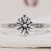 Round diamond engagement ring in white gold.
