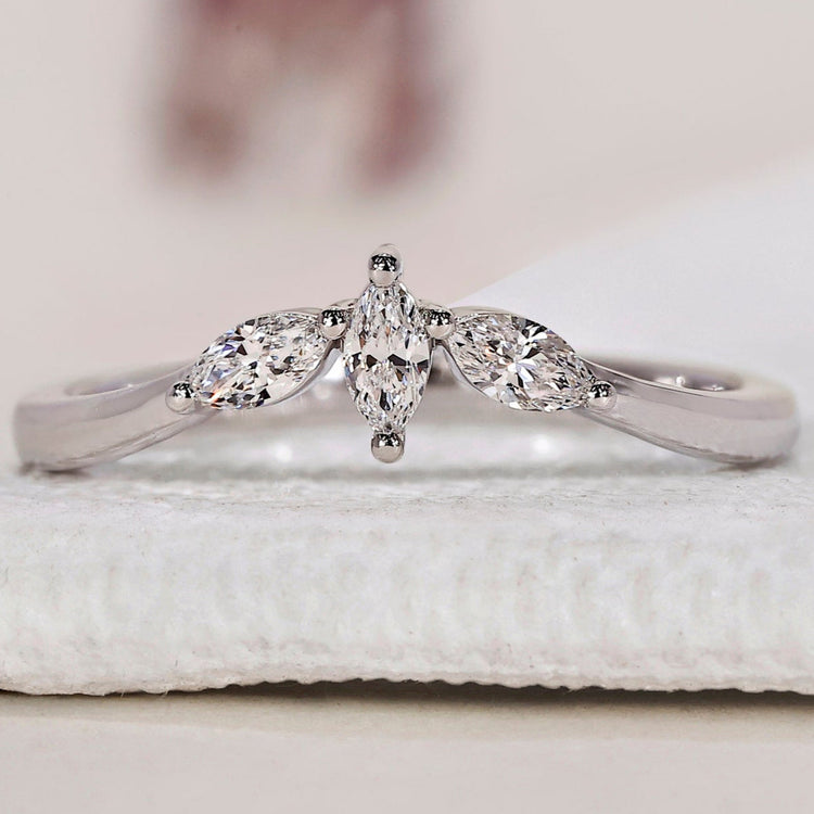Elegant marquise wedding band with intricate design and flawless craftsmanship.
