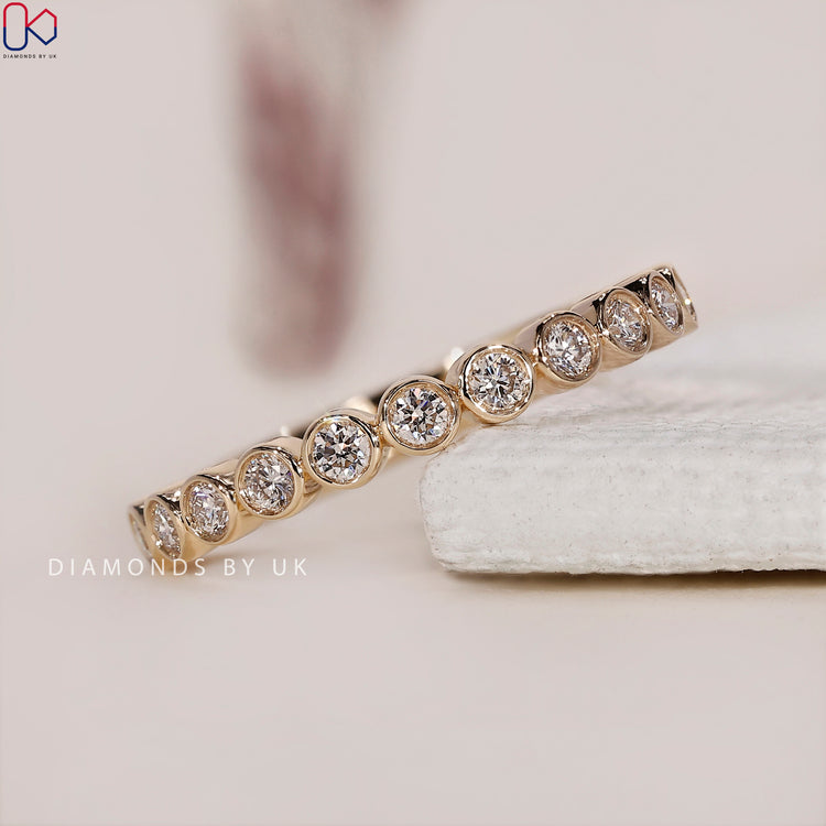 Gold band round diamond wedding ring for a sophisticated and elegant design.

