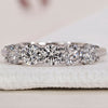 Elegant 5 Stone Diamond Wedding Band with a timeless design in white gold.
