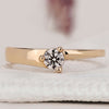 Solitaire engagement ring with a round brilliant cut diamond.
