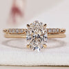 Oval engagement ring with wedding band in a classic design.
