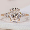 3 stone diamond engagement ring with oval center.
