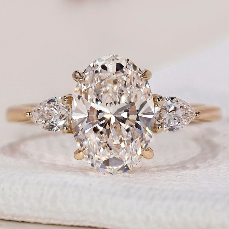 3 Stone Engagement Ring - Oval and Pear Diamond