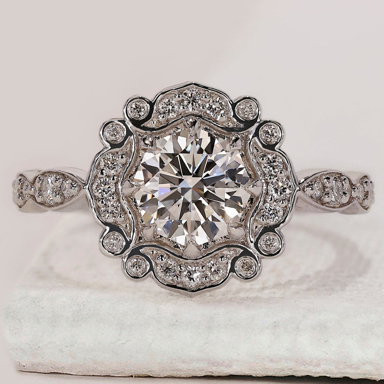 Bezel setting engagement ring with round diamond centre.
