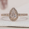 Pear Shaped Engagement Ring with a stunning halo diamond ring design.
