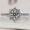 Diamond cluster ring with sparkling round diamonds in white gold.
