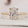 Oval cut engagement ring with 4 claw prong setting.
