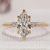 Three stone marquise diamond ring in yellow gold.
