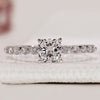 Shared prong diamond eternity ring crafted with lab grown diamonds and cushion cut detail.