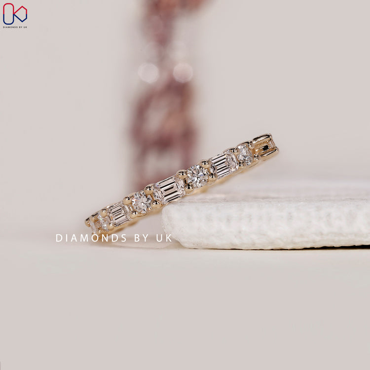 Diamondsbyuk yellow gold wedding band.
