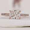 Hidden halo engagement ring with radiant cut diamond.
