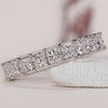 Channel set eternity band featuring stunning princess cut diamonds.
