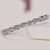 Elegant White Gold Eternity Band with sparkling diamonds.
