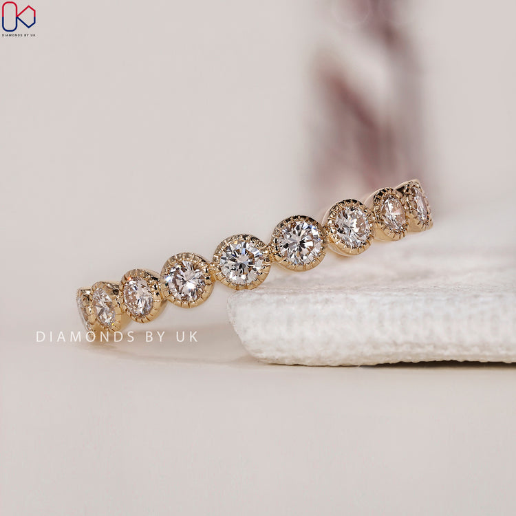 Milgrain wedding band with intricate detailing and a diamond eternity band design.
