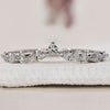 Curved Diamond Wedding Band with sparkling diamonds set in a sleek design.
