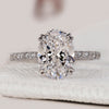 Oval cut diamond ring with a white gold band.
