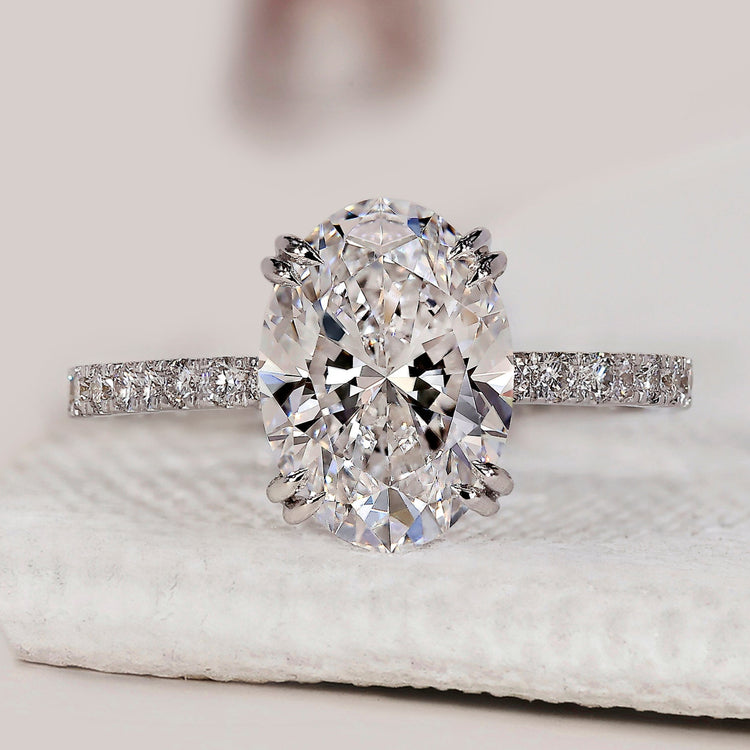Oval cut diamond ring with a white gold band.
