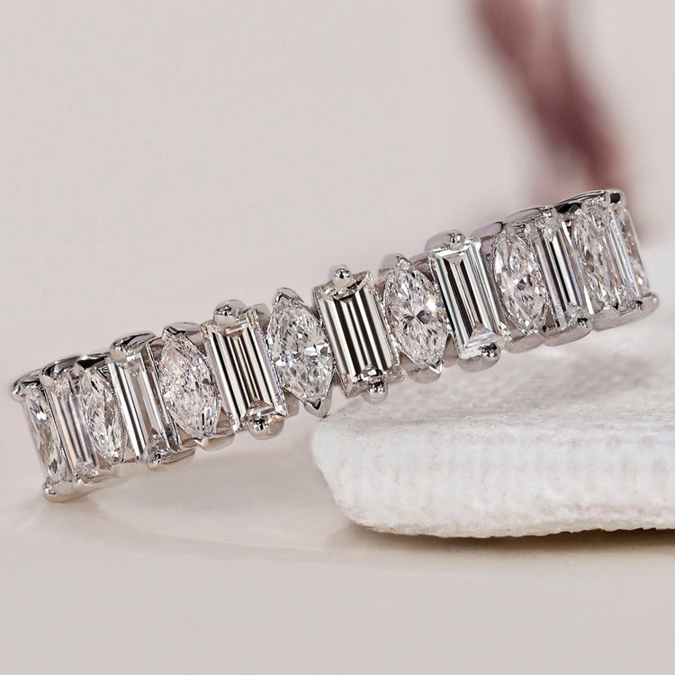 Diamond half eternity band with baguette and marquise diamonds.
