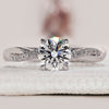 Round cut diamond ring with twisted pave engagement ring.
