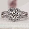 Round diamond engagement ring with halo setting.
