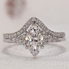 Marquise diamond ring and chevron band in a stylish design.
