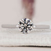 Round solitaire engagement ring with a classic design.
